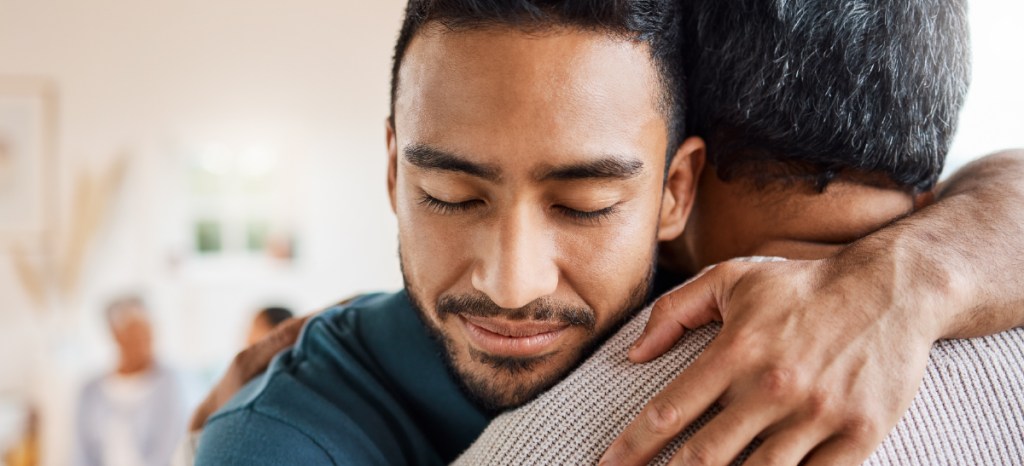 Two people embracing during Minority Mental Health Awareness Month